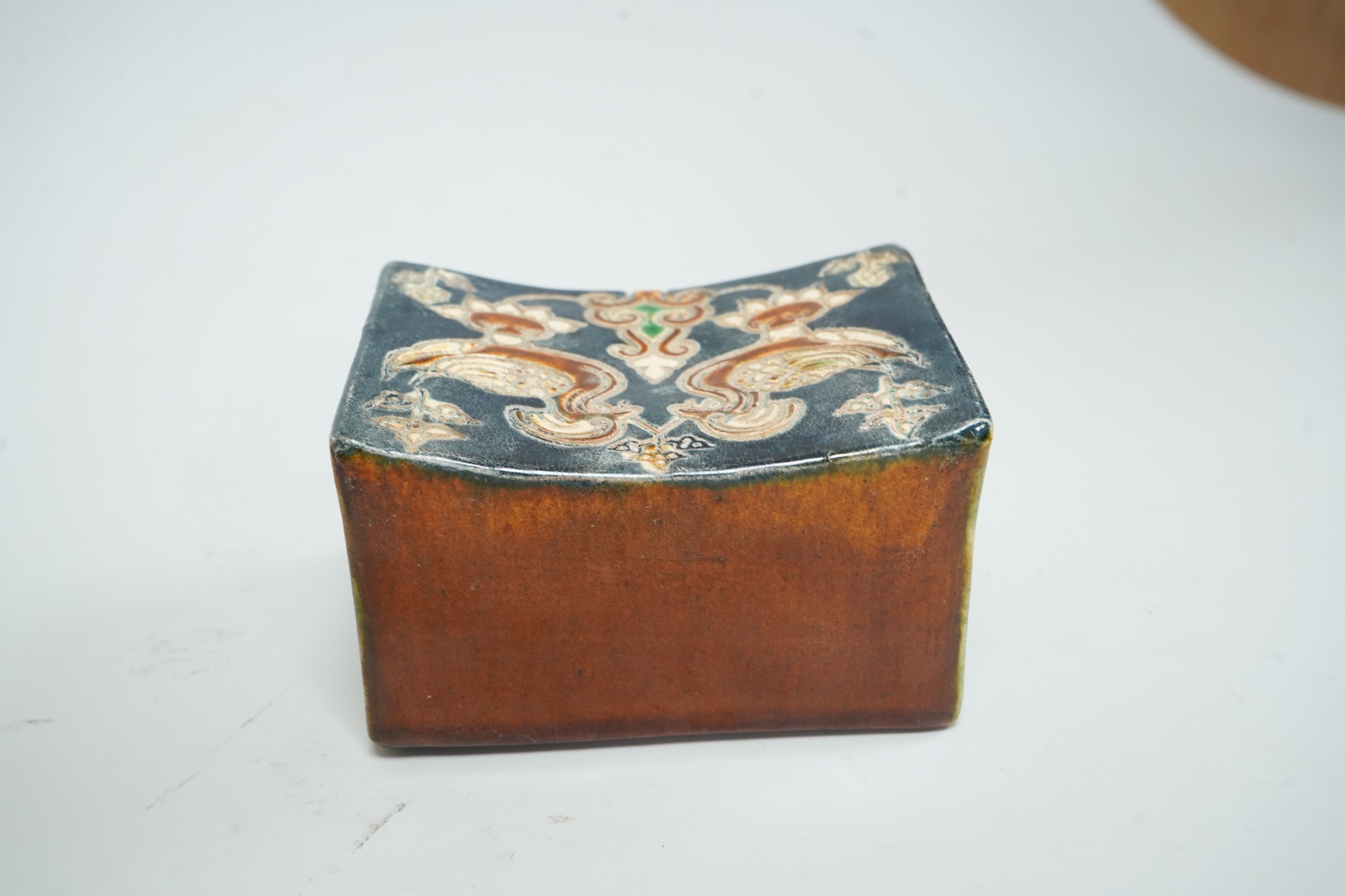A Chinese stone ware arm rest, 10cm wide